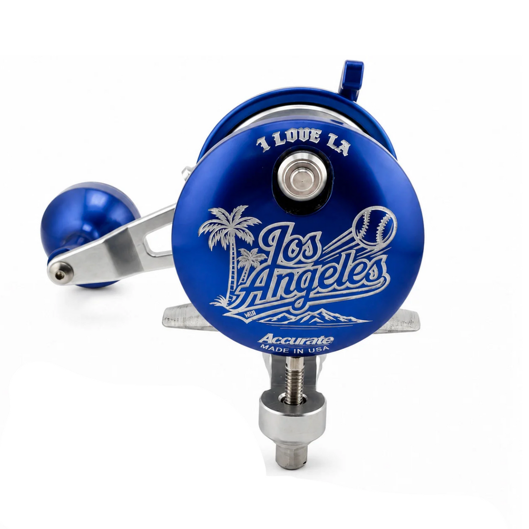 Blue and silver fishing reel shown from multiple angles on a clean white background, featuring Los Angeles-themed graphics including palm trees, a baseball, and the text 'I Love LA' and 'Accurate'.