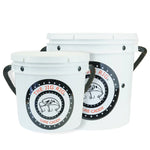 Two white plastic buckets with black rope handles, featuring a circular black, white, and red logo that reads 'THE JIG RIG LURE CADDY'.