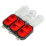 Fishing tackle box with red compartments and a clear lid on a white background