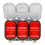 Three-section fishing tackle box with red compartments and clear lids on a white background