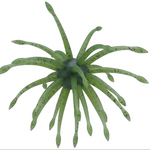 A green artificial sea anemone fishing lure with multiple translucent arms and small dark speckles, shown on a plain white background.