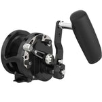 Black fishing reel with a handle on a white background