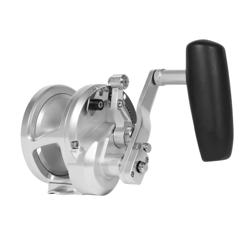 Fishing reel with metallic body and black handle on a white background