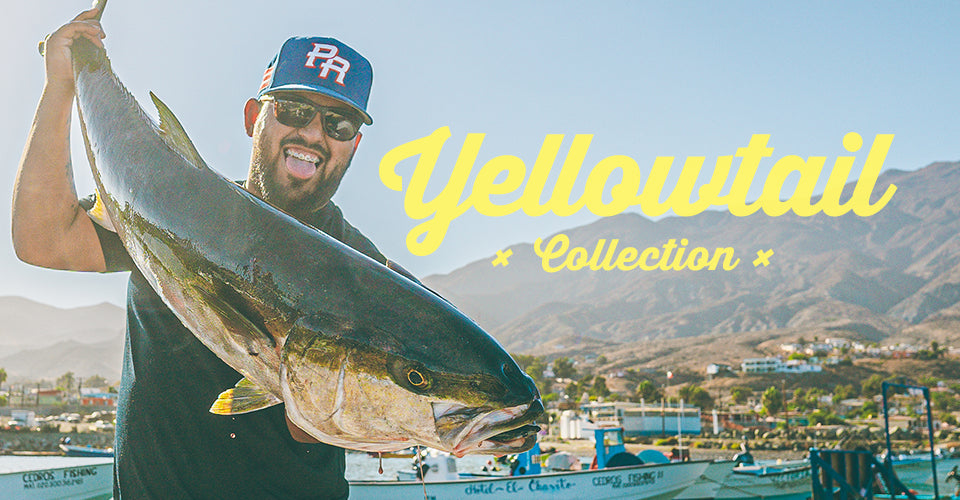 Man holding a large yellowtail with 'Yellowtail Collection' text in a scenic outdoor setting