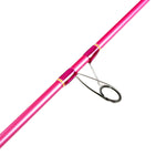 Pink fishing rod with a silver reel on a white background