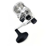 Fishing reel with metallic body and black handle on a white background