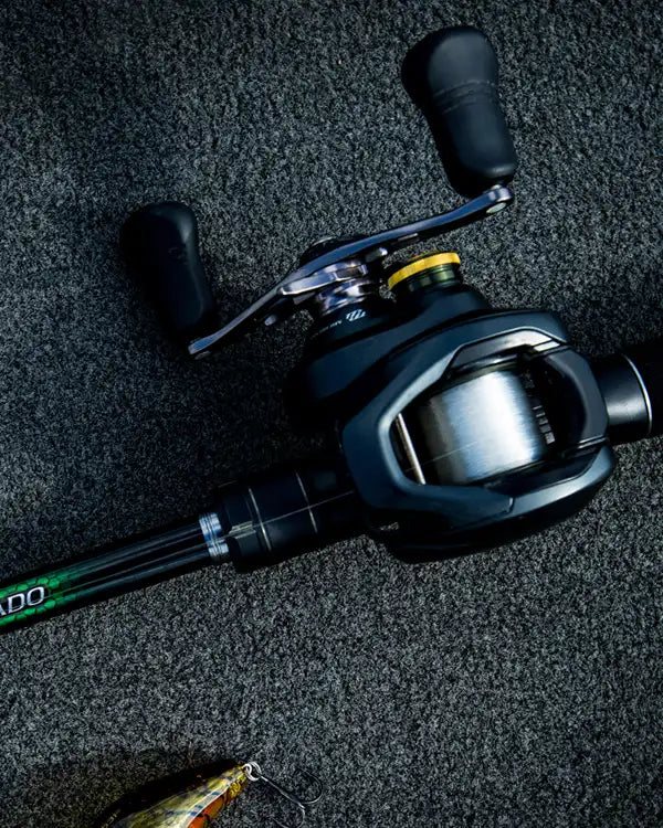 Fishing reel on a textured carpet surface