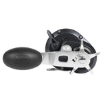 Shimano fishing reel with a black handle and black spool, featuring a silver metal bail and line guide, shown against a plain white background.