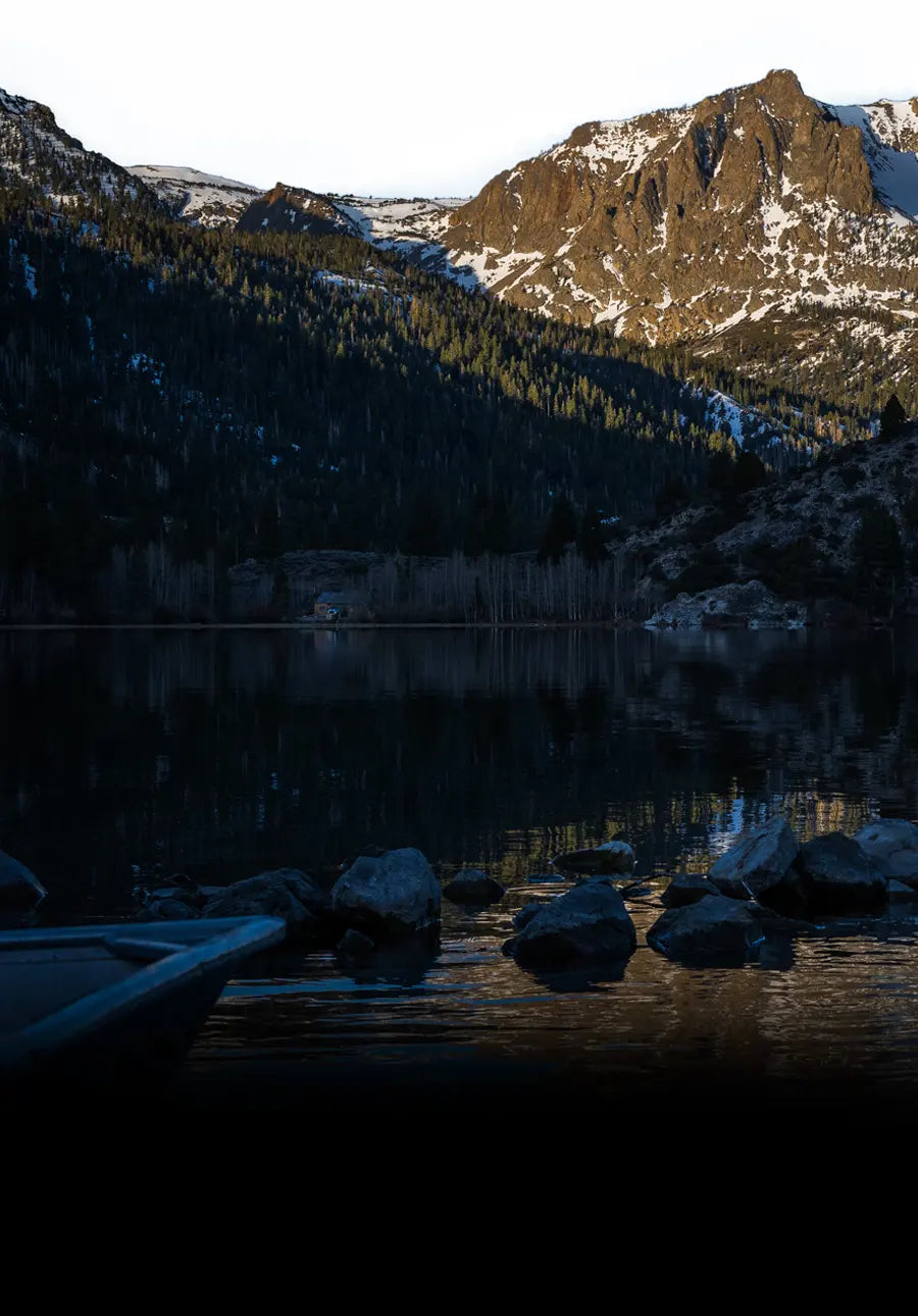 Mountainous landscape with a lake at sunset